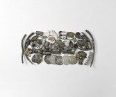 Viking Silver 'Hack' Collection
10th-12th century AD. A mixed group of hack silver including: twisted and plain rod fragments from a bracelet(?); two...