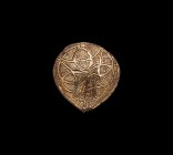 Viking Gilt Silver Box Mount
10th-12th century AD. A discoid silver-gilt appliqué with hatched surface, reserved knot motifs. 5.07 grams, 33mm (1 1/4...
