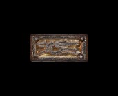 Pre-Viking Gilt Silver Dragon Mount
7th-8th century AD. A silver-gilt rectangular mount with pin to each corner, framed surrounding a quadruped with ...