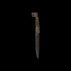 Viking Knife with Carved Handles
9th-11th century AD. An iron single-edged knife with broad back, with carved modern antler handle in the form of a d...