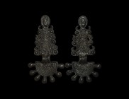 Germanic Radiate Brooch Pair with Faces
6th century AD. A matched pair of bronze bow-brooch derivative forms comprising a D-shaped headplate with chi...