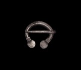 Viking Silver Pennanular Brooch
9th-11th century AD. A miniature silver penannular brooch with discoid terminals. 1.4 grams, 17mm (3/4"). Property of...