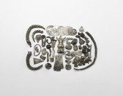 Viking Silver 'Hack' Collection
10th-12th century AD. A mixed group of hack silver items including: fragments of a bracelet of twisted rods and a sim...