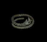 Viking Twisted Bracelet
9th-11th century AD. A bronze coiled bracelet formed from three round-section rods twisted around each other; applied conical...