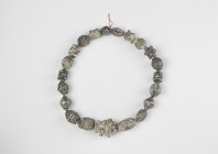 Viking Silver Bead Group
10th-12th century AD. A restrung group of silver beads, mainly melon, oblate and polyhedral with radiating lobes types. 109 ...