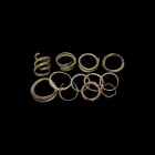 Viking Finger and Hair Ring Collection
9th-12th century AD. A mixed group of bronze rings including coiled types, solid hoop types, flat-section type...