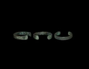 Viking Decorated Bracelet
9th-11th century AD. A flat-section bronze bracelet with slightly flared terminals, the outer face with punched pellet and ...