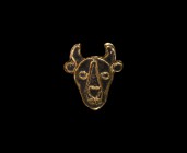 Merovingian Gold Enamelled Bull Head Brooch
5th century AD. An iron plate brooch of a facing bull-mask (bucranium) with gold foil sheath and red enam...