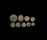 Saxon Pierced Roman Coin Group
5th-6th century AD. A mixed group of bronze necklace pendants formed by piercing a Roman bronze coin for suspension. S...