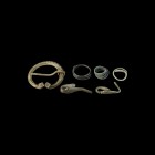 Viking Artefact Collection
9th-11th century AD. A mixed group of bronze items comprising: a large penannular brooch with lozengiform terminals; two r...