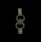 Anglo-Norman Hunting Dog Leash Swivel
11th-12th century AD. A swivel with two rings, each loop formed as a pair of opposed zoomorphic heads clutching...