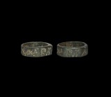 Medieval Inscribed Ring
12th-14th century AD. A lead ring comprising a flat-section hoop with running zigzag, plaque with hatched initials 'PC'. 10.1...