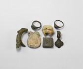 Medieval and Later Artefact Collection
12th-15th century AD. A mixed group comprising: a lead-alloy pilgrim's ampulla; a bifacial lead model head (da...