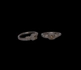 Medieval Ring with Hipped Shoulders
14th century AD. A silver finger ring with square bezel with hatched detail and hipped shoulders, D-section hoop....