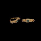 Medieval Gold Turret Ring with Emerald and Garnets
14th-15th century AD. A Javanese gold ring comprising a D-section hoop and rectangular bezel with ...