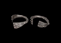 Medieval Silver 'Baniska Treasure' Type Twisted Bracelet Pair
13th century AD. A pair of silver bracelets formed from hollow rods twisted about each ...