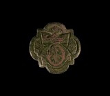 Medieval Heraldic 'Thomas à Becket' Horse Harness Stud
14th-15th century AD. A bronze quatrefoil mount with low-relief Lombardic script 'T' crowned a...