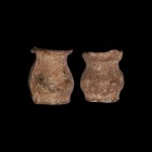 Medieval Lead Vessel Pair
13th-14th century AD. A pair of miniature lead vessels, both with flat discoid base, globular body and flared rim. 42 grams...