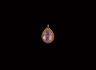 Post Medieval Gold Pendant with Spinel Gemstone
17th-18th century AD. A gold teardrop-shaped pendant with scalloped edge, inset facetted spinel; susp...