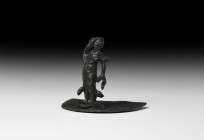 Post Medieval Salt Box Lid with Figure
17th-18th century AD. A bronze D-shaped lid with applied figure of a lady in flowing robes. 29 grams, 55mm (2 ...