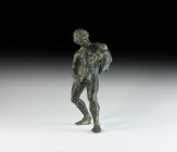 Roman Grand Tour Statuette
19th century AD. A bronze figure of a naked youth standing pouring win from a wineskin over his left arm into a vessel hel...