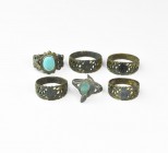 Post Medieval Ring Group
19th-early 20th century AD. A group of six rings comprising: four bronze rings with flat-section hoop, widening with openwor...