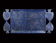Roman Grand Tour Glass Fish Plate
19th century AD or earlier. A shallow cobalt blue glass dish, rectangular in form with everted rim; the handles for...