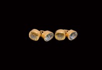 Vintage Gold Cufflink Pair
20th century AD. A matched pair of gold cufflinks, each a pair of drum-shaped gold cells with connecting link, faceted yel...