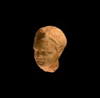 Roman Grand Tour Marble Head of a Boy
18th-19th century AD. A carved marble juvenile head with short tousled hair and filet to the brow, large lentoi...