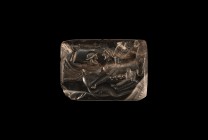 Neoclassical Amulet with Sphinx Attacking Man
18th century AD. A banded agate rectangular bead with rounded edges, with a neoclassical image of a win...