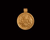 Greek Gold Grand Tour Poseidon Pendant
19th century AD. A large gold pendant with applied ribbed suspension loop, concave disc with high-relief image...