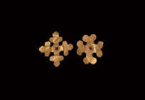 Byzantine Gold Cross Pair
4th-6th century AD. A pair of gold appliques, each formed as an equal-armed cross, garnet cabochon within beaded frame to t...