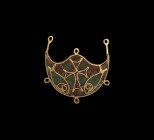 Post Medieval Gold Pendant with Ancient Inlays
20th century AD and earlier. A gold lunate plaque with six suspension loops to the outer edge, inset d...