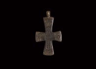 Byzantine Cross Pendant with Saints
7th-9th century AD. A bronze bifacial cross pendant with loop above, engraved to one side with figure in orans po...