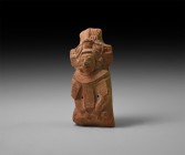 Pre-Columbian Maya Moulded Rattle Figure
250-900 AD. A moulded terracotta rattle formed as a squatting warrior wearing an elaborate headdress and col...