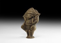 Pre-Columbian Arhuaco Statuette
1st millennium AD. A hollow-formed ceramic figurine depicting a mythical(?) figure in seated pose on a flared base, t...