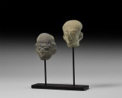 Pre-Columbian Head Group
1st millennium AD. A group of two ceramic human heads, each with rounded cap, broad lentoid eyes, flared nose, large ears; m...