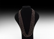 Natural History - Garnet Bead String Group
. A group of five strings of polished irregular garnet beads. 369 grams total, 88cm each (34 1/2"). Proper...