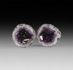 Natural History - Polished Amethyst Geode Pair
. An agate geode, sawn and polished, lined with amethyst and accessory calcite, with stands. 723 grams...