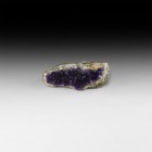 Natural History - Brazilian Amethyst on Quartz
. A geode fragment of crystalline amethyst on a quartz base; with old dealer's label. 362 grams, 14.5c...