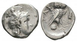 Ancient Greek Coins - Calabria - Tarentum - Owl Drachm
302-281 BC. Obv: helmeted head of Athena right, helmet ornamented with Scylla. Rev: TAR to lef...