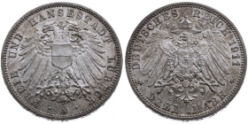 Lübeck 
3 Mark
1911
A Berlin

Vs: Doppelköpfiger Wappenadler der Stadt Lübeck mit Brustschild, unten Münzstättenbuchstabe, Umschrift "FREIE UND H...