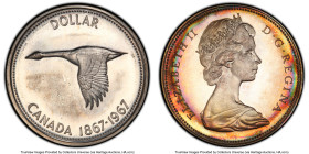 Elizabeth II Prooflike Dollar 1967 PL67 PCGS, Royal Canadian mint, KM70. A mesmerizing polychromic patina brushes the margins of this lovely offering....