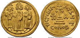 Heraclius with Heraclius Constantine, and Heraclonas (AD 632-641). AV solidus (20mm, 4.31 gm, 7h). NGC Choice XF 5/5 - 2/5, light graffito, clipped. C...