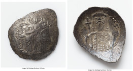 Alexius I Comnenus (AD 1081-1118). BI aspron trachy (25mm, 2.25 gm, 6h). AG. Constantinople, after ca. AD 1092. Christ seated facing on throne with sq...