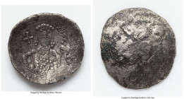 Alexius I Comnenus (AD 1081-1118). BI aspron trachy (27mm, 3.83 gm, 5h). AG. Constantinople, after ca. AD 1092. Christ seated facing on throne with sq...