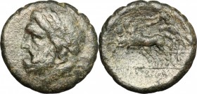 Sicily. Syracuse. Roman Rule. AE 21 mm., after 212 BC. D/ Laureate head of Zeus right; [symbol] behind. R/ [ΣΙΡΑΚΟΣΙΩΝ]. Nike driving galloping biga l...