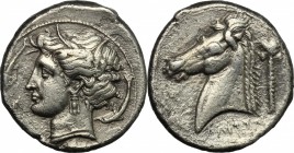 Punic Sicily. Punic Sicily. AR Tetradrachm, 4th century BC. D/ Head of Tanit left, wearing wreath; surrounded by dolphins. R/ Head of horse left; behi...
