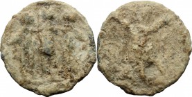 PB Tessera, c. 1st century AD. D/ Aeneas, Anchises and Ascanius standing frontal. R/ Trophy. cf. Rostowzew 118 (quadratic). PB. g. 3.02 mm. 17.00 Good...