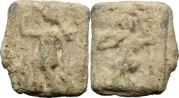 PB Tessera, c. st century AD. D/ Figure in military attire standing left, holding spear and leaning on shield set on ground. R/ Figure advancing left;...